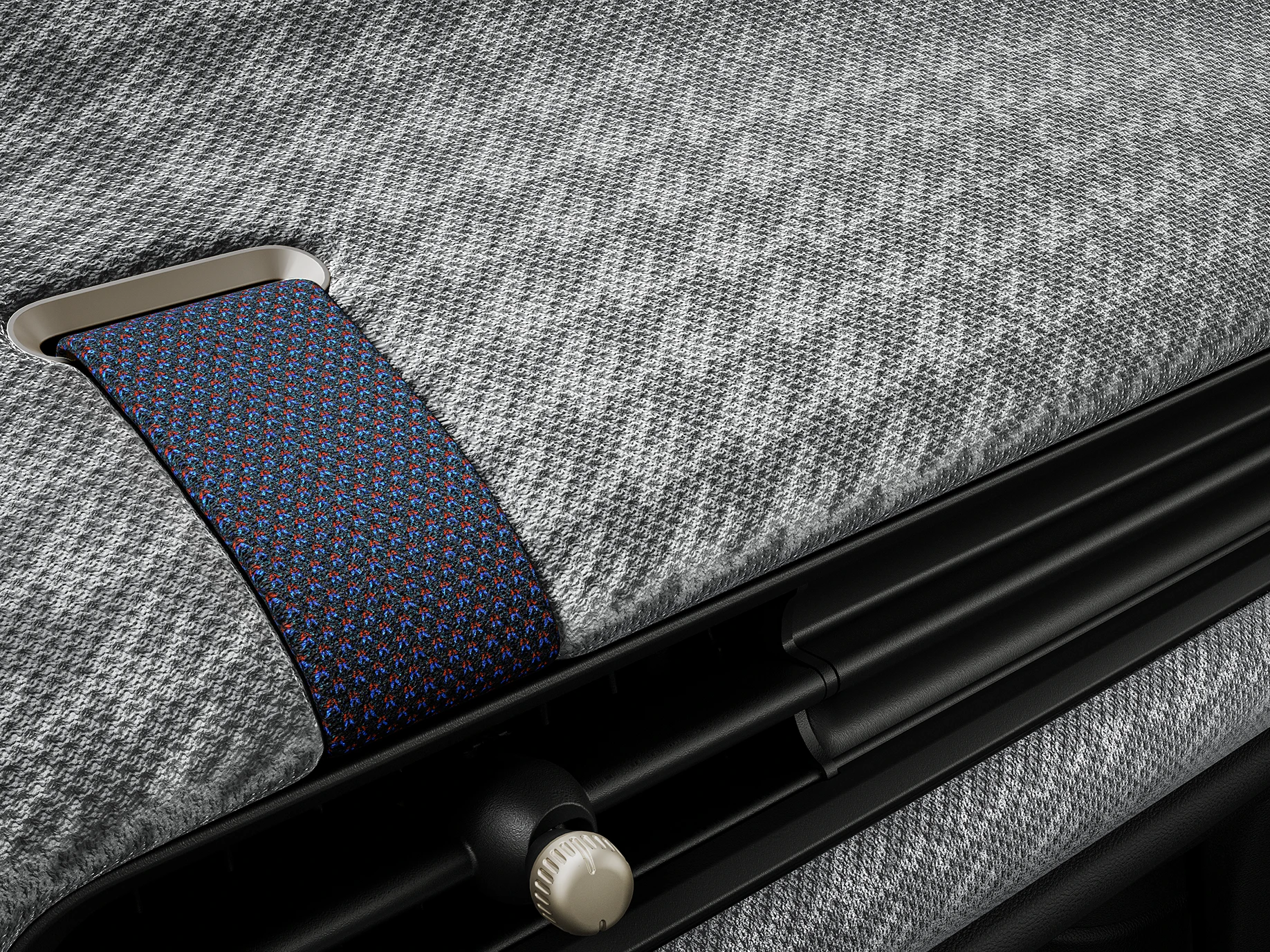 Vue rapprochée du tableau de bord façon tissu tricoté 2D à l'intérieur de la MINI Cooper.