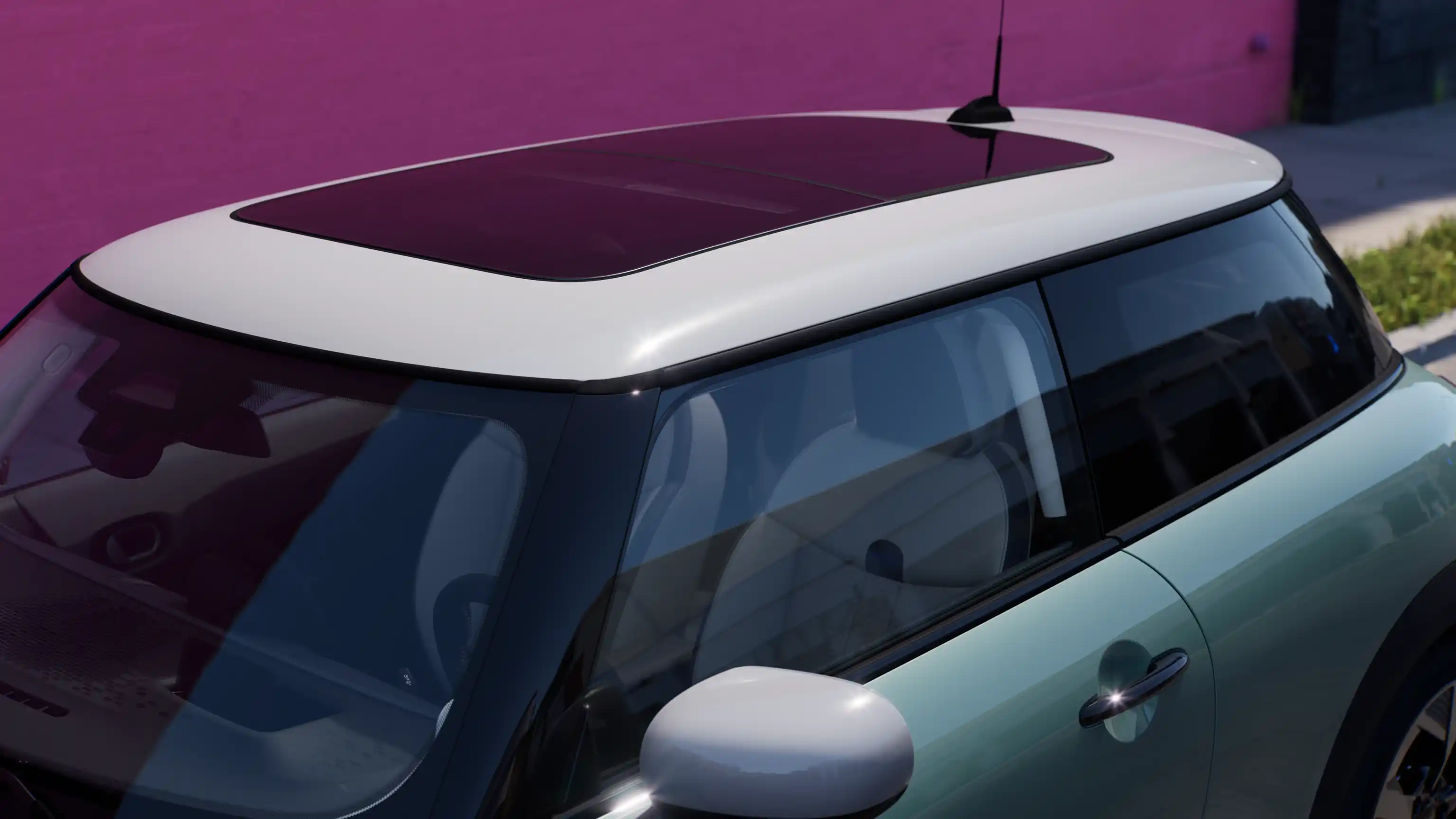 Vue intérieure de la MINI Cooper 3 Portes en Ocean Wave Green avec toit ouvrrant en verre.