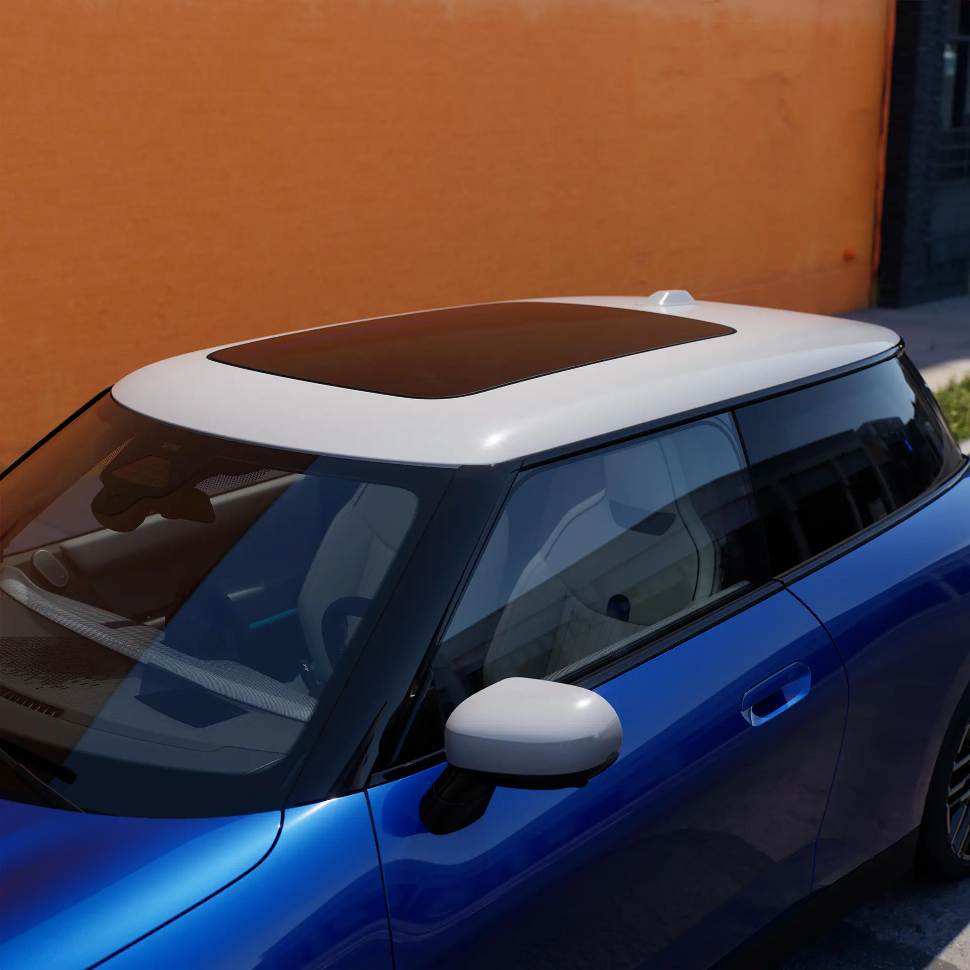 Vue du dessus d’une MINI Cooper Electric Blazing Blue avec toit panoramique en verre de blanc.
