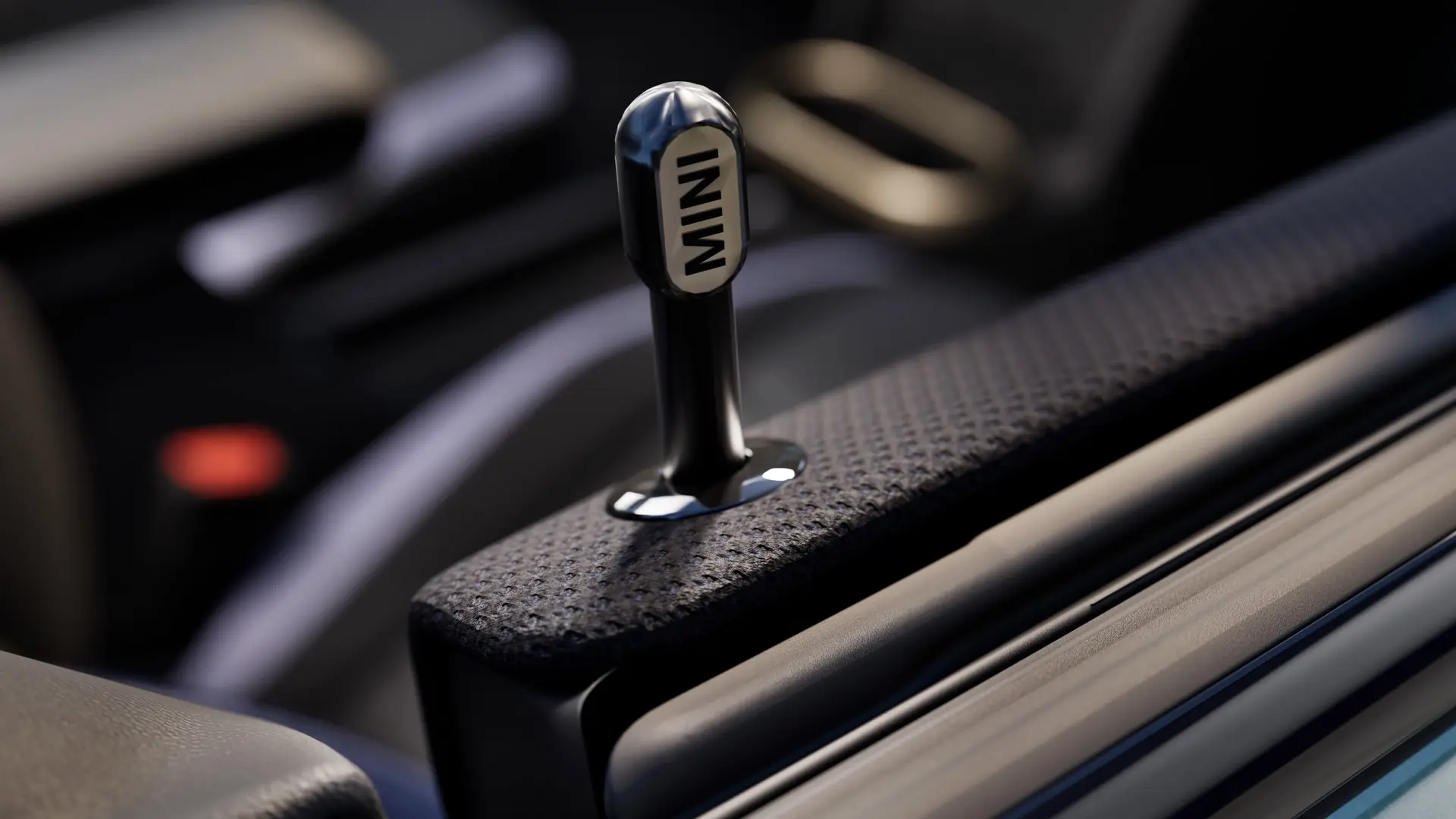 Plan rapproché de la goupille de verrouillage de la porte intérieure MINI d'origine en aluminium anodisé noir.